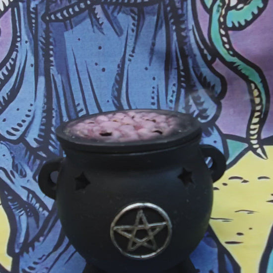 hand blended incense burning in the cauldron 