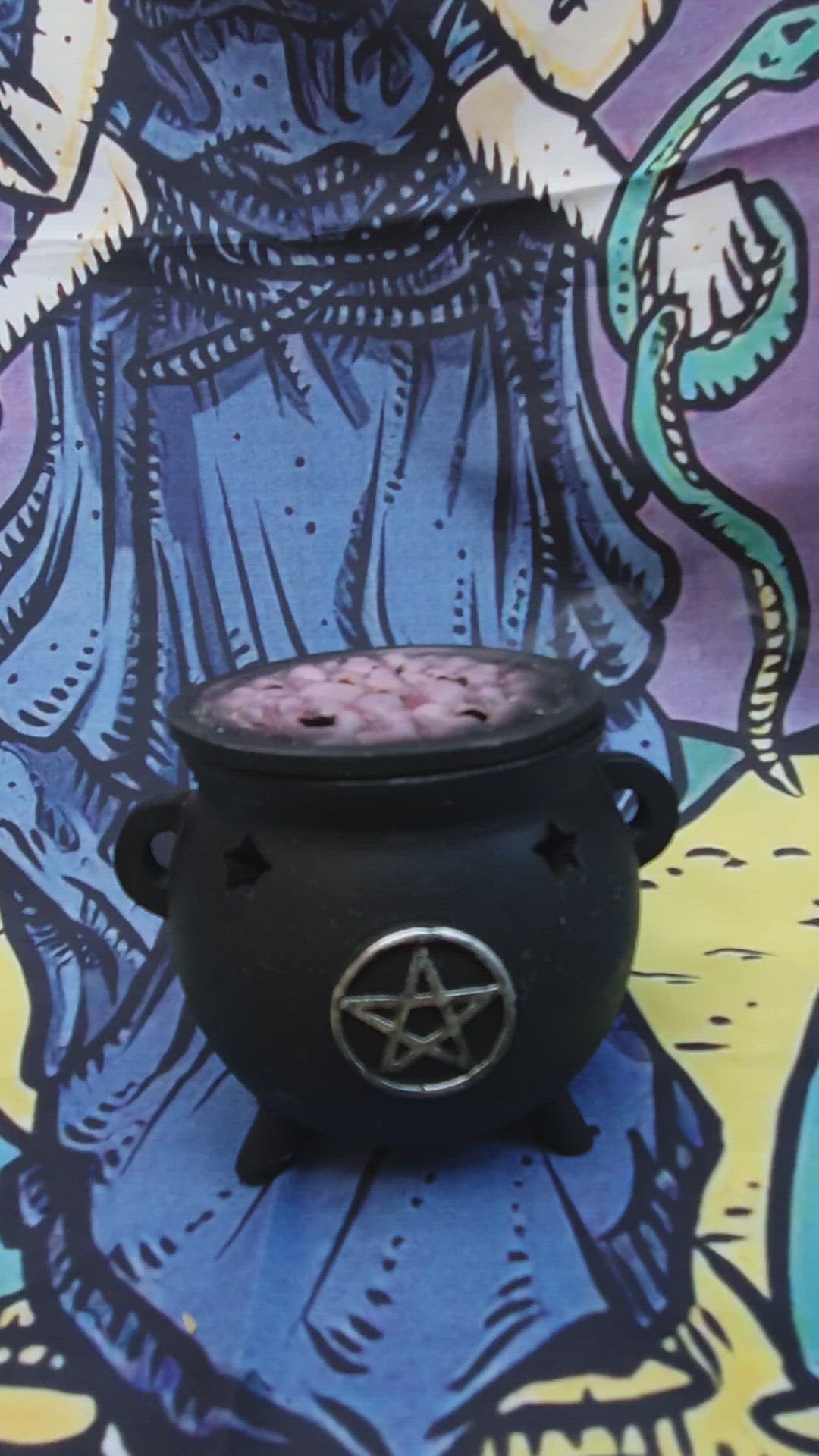 hand blended incense burning in the cauldron 